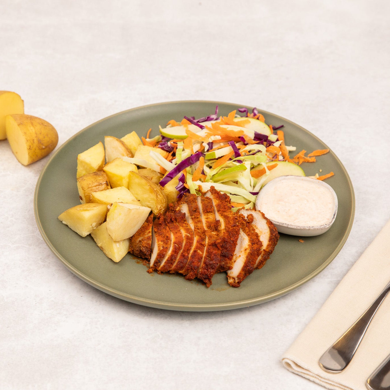 Crumbed Chicken with Roast Potatoes & Apple Slaw